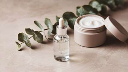 Minimalist Skincare Product Display with Serum and Cream on Neutral Background