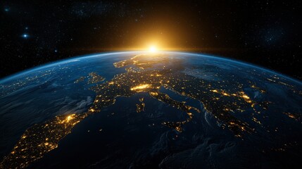 Fototapeta premium A beautiful view of the Earth at night, with the sun rising in the distance
