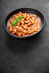 White bean tomato sauce delicious gourmet food background on the table rustic food top view copy space keto and paleo diet vegetarian and vegan food