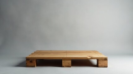 A simple wooden pallet rests on a neutral backdrop, offering a versatile platform for display or product presentation.