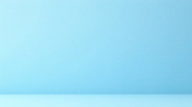 A serene light blue backdrop featuring a subtle textured wall and a smooth floor, ideal for showcasing products or creating minimalist designs.