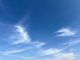 Soft white clouds in blue sky