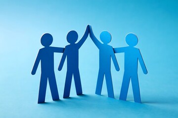 Teamwork Makes the Dream Work: Four blue paper figures form a circle, their hands reaching up in a high-five, symbolizing collaboration, unity, and shared success.
