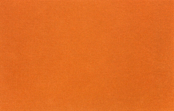 The texture of the canvas fabric is orange color. Horizontal abstract blank background for design ideas. Rustic linen.