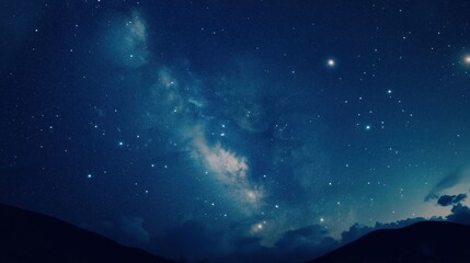 Fototapeta premium Night sky reveals a stunning display of stars and galaxies above a serene mountain landscape