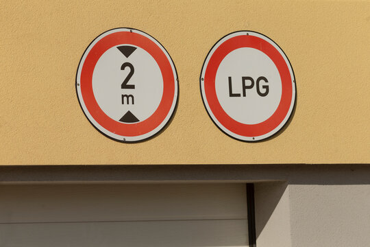 There is a sign displayed prominently on a wall that features the symbols 2e and lpg, indicating specific information or directions