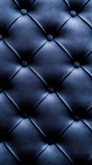 Naklejka premium Close-up of blue leather upholstery showcasing aged velvet texture, emphasizing luxurious and elegant design features