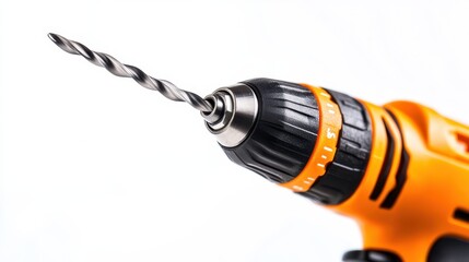 A close-up of a power drill with a drill bit inserted on a white isolated background