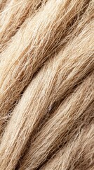 Fototapeta premium Thick and durable rope made from natural coconut husk fibers with intricate textures for nautical and craft use