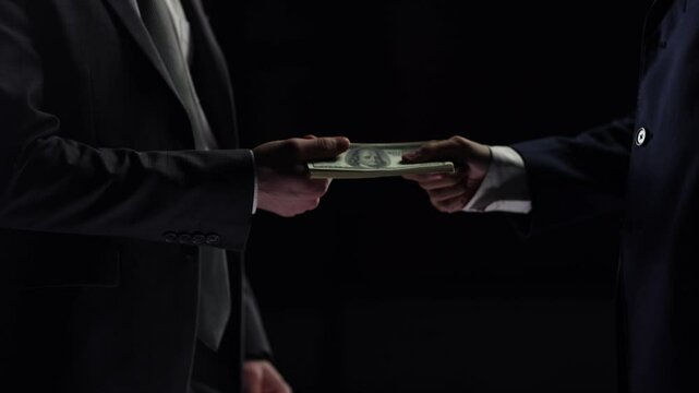 Illegal transfer of money and bribery in close-up, the concept of crime