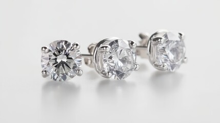 A set of elegant diamond stud earrings on a white isolated background