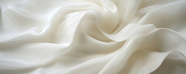 Fototapeta premium White silk fabric swirls, studio shot, soft background, textile design