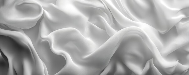 Fototapeta premium White silk fabric drapes, studio shot, background blur, textile design