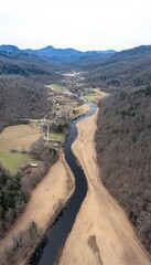 High-Angle View of Winding River Valley with Rural Homes