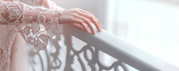 Elegant female hand resting on ornate railing with delicate lace sleeve. Soft pastel tones creating romantic vintage atmosphere. femininity, timeless beauty, Bridal Elegance. Banner. Copy space