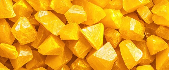 Pile of yellow crystals showcasing the natural beauty and texture of sulfur in a detailed close-up composition