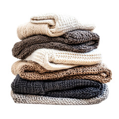 a stack of folded sweaters on a table
