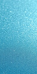 Fototapeta premium Close-up of textured blue glitter paper, sparkling surface, craft supply, blue background