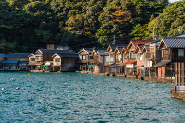 Beautiful later afternoon sight in Ine Bay, with the typical Funaya boat houses. Kyoto, Japan.