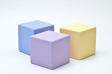 Obraz premium Three pastel cubes on white background. (1)