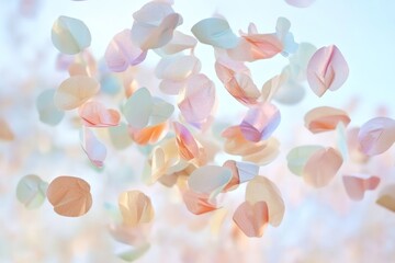A joyful confetti toss in pastel shades, suspended in the air against a soft backdrop