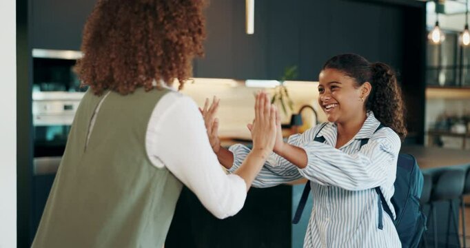 Mom, girl and high five in home to school, kid and excited to start learning, education and love. People, mother and daughter with cheers, celebration and support for good grades at family house