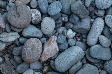 Mosaic of river stone rounded due to weathering by the flowing water of Hell Roaring Creek, Yellowstone National Park
