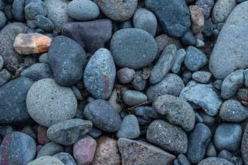 Mosaic of river stone rounded due to weathering by the flowing water of Hell Roaring Creek, Yellowstone National Park