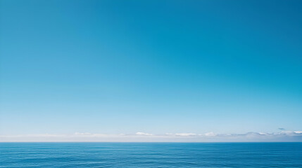 Obraz premium Tranquil Deep Blue Ocean Meets Clear Sky With Distant Clouds on Horizon in Sunny Seascape
