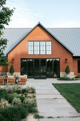 Obraz premium Modern brick building with large windows and a welcoming entrance, surrounded by landscaped greenery and comfortable seating areas for outdoor relaxation