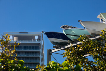 boat storage with apartment building in the background