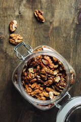 Shelled walnuts in jar.