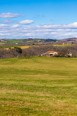 Hilly landscape of the Ségala mountains around Monestiés, dotted with small farms