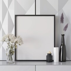 A black framed picture mockup with a white vase. dried flowers. and a black bottle on a white countertop in front of a geometric pattern background