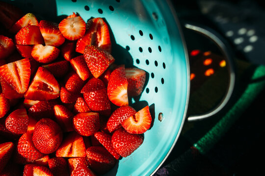 Strawberries in blue colander 