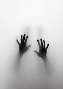 Mysterious blurred silhouette of hands pressing against frosted glass, creating a dramatic and eerie horror concept of fear and isolation