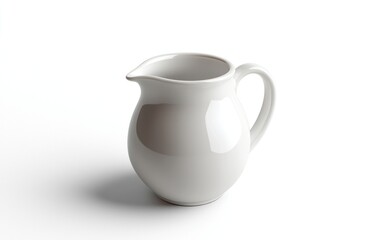 White ceramic creamer or small pitcher on white background. Simple, clean design. Studio lighting