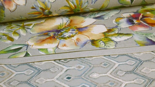 Catalog of wallpaper samples for walls in close-up. Wallpaper store. The concept of design and renovation of the house. The choice of decorative coatings.