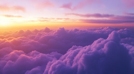 Aerial view of vibrant sunset above fluffy purple clouds.