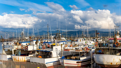boat motor yacht in sea port. Sailboat moored to pier in yacht marina. Sailing and yachting...