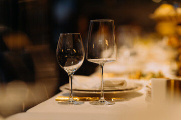 Elegant dining setup with wine glasses on a beautifully arranged table