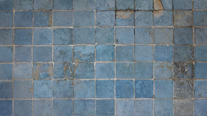 Obraz premium Old, broken blue tile floor