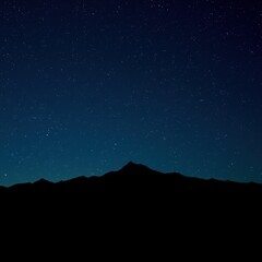 Fototapeta premium Celestial Mountainscape at Night