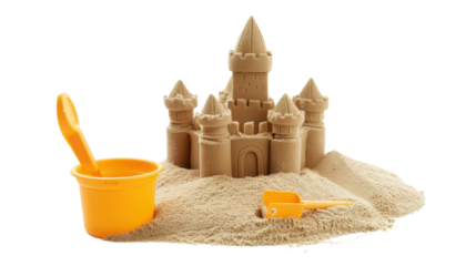 Sandcastle standing on a pile of sand with bucket and shovel on transparent background