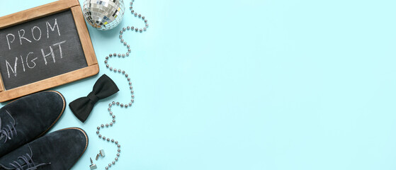 Chalkboard with text PROM NIGHT, male shoes and disco ball on blue background © Pixel-Shot