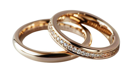 Two golden wedding rings intertwined, embellished with sparkling diamonds on transparent background
