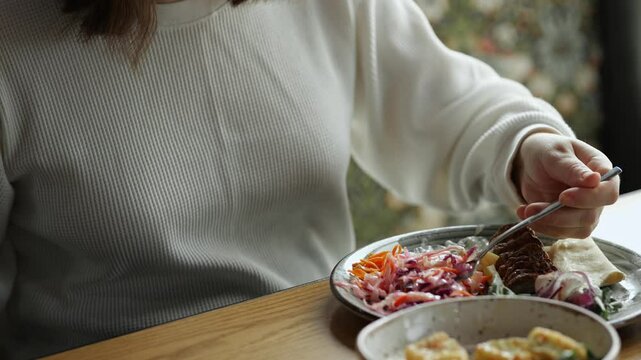 Woman enjoying a healthy meal at restaurant