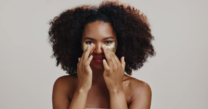 Skincare, eye patch with face of woman in studio for beauty, hydration and self care. Cosmetics, glow and dermatology with African person on white background for shine, spa treatment and facial