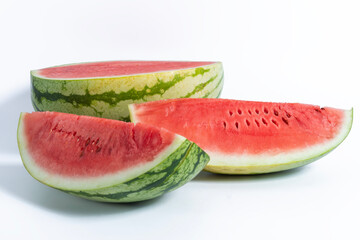 Freshly cut watermelon slices displayed against a white background