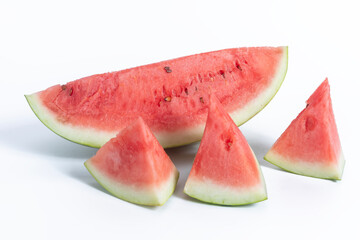 Freshly sliced watermelon pieces on a white background